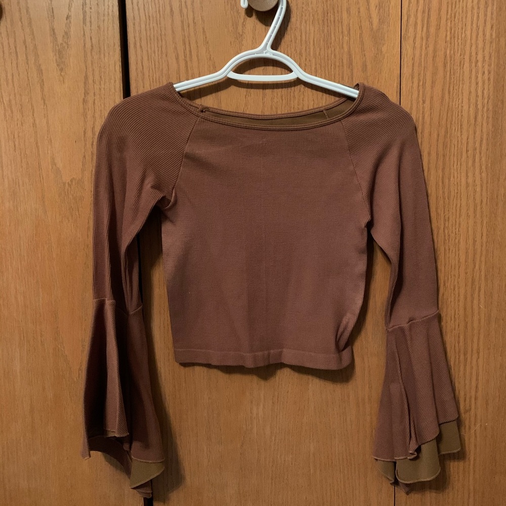 Light brown shirt with flared sleeves